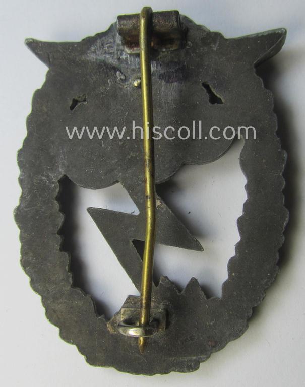 Relic- (ie. denazified), mid- (ie. later-) war-period, zinc- (ie. 'Feinzink'-) based version of a WH (Luftwaffe) 'Erdkampfabzeichen' as was produced by the: 'J.E. Hammer u. Söhne'-company