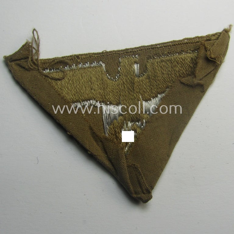 Attractive, N.S.D.A.P.-related cap-eagle as was intended for the: 'Lagermütze' (ie. side-cap) being an example as woven in bright-silver on a brownish-coloured background and as such intended for students serving within one of the: 'Ordensburgen'