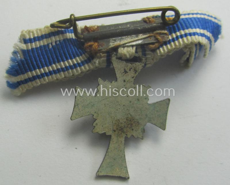 Miniature of an: 'Ehrenkreuz der deutschen Mutter - zweite Stufe' (or: silver-class mothers'-cross) being a non-maker-marked example that comes in an overall nice- (albeit moderately worn- ie. used-), condition