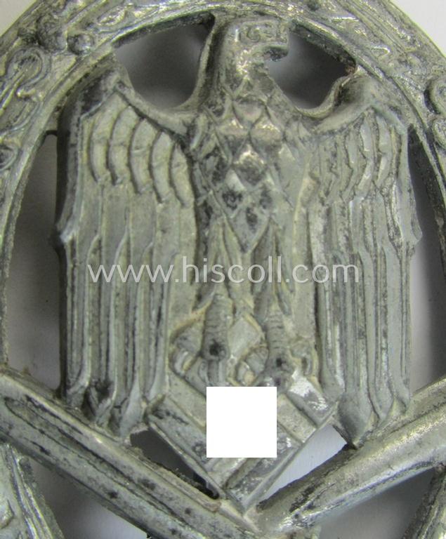 'Allgemeines Sturmabzeichen' (or: General Assault Badge ie. GAB) being a typical unmarked, zinc-based- (ie. 'Feinzink'-) and/or: 'semi-hollow-back'-version as was (I deem) produced by the: 'Rudolf Karneth'-company