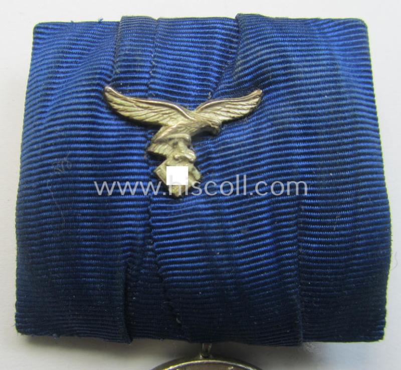Attractive, bright silver-toned WH (Luftwaffe) so-called: 'Einzelspange' showing a: 'WH-Dienstauszeichnung 4. Stufe' (as was intended for 4 years of loyal-service) and that shows a detailed, Luftwaffe-type-eagle-device, period-attached