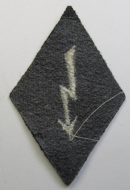 Neat, Waffen-SS-pattern-, machine-embroidered and black-coloured sleeve-insignia (ie. 'Ärmelraute') depicting a so-called: 'Signalblitz', as was used and intended to signify membership within a: 'Waffen-SS Nachrichten'-unit
