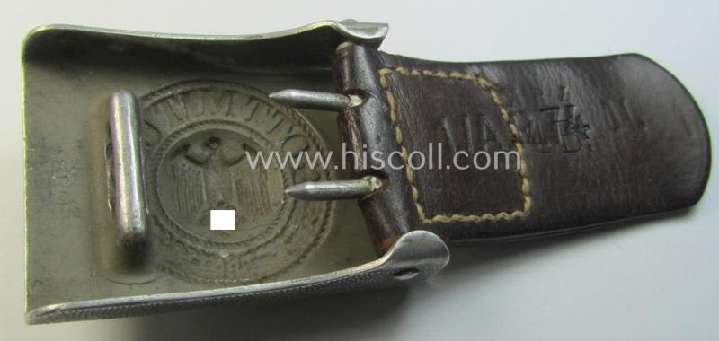 Superb, WH (Heeres) 'standard-pattern', field-grey-toned- and aluminium-based belt-buckle being a maker- (ie. 'Bernh. Haarmann'-) marked- and/or '1939'-dated example that comes mounted onto its (unit-stamped!) leather-based tab