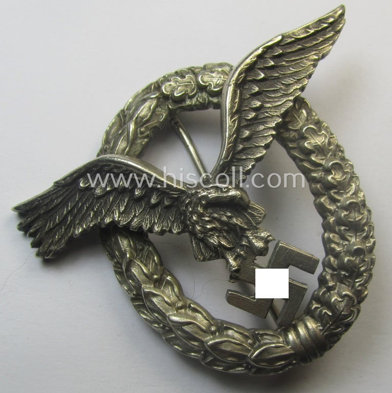 Early- (ie. pre-) war-period- and/or: 'Buntmetall'- (ie. 'Tombak'-) based: WH (Luftwaffe) 'Flugzeugführerabzeichen' (or: pilots-badge) being a maker- (ie. 'C.E. Juncker'-) marked example of the 'J3'-pattern