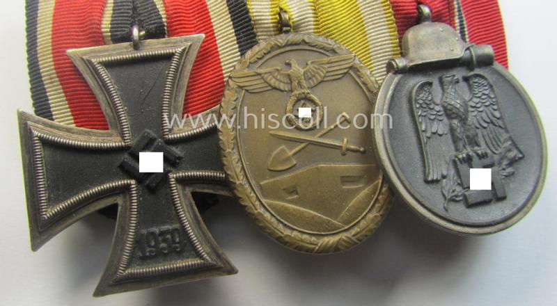 3-pieced, WWII-period medal-bar (ie. 'Ordenspange') showing resp. an: 'EKII.Kl.', a: 'Westwall'-medal and a: 'Medaille Winterschlacht im Osten 1941-42'