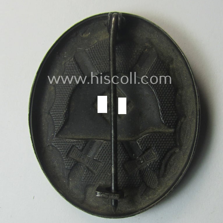 Truly worn - and neatly maker- (ie. '16'-) marked! - example of a black-class wound-badge (or: 'Verwundeten-Abzeichen in Schwarz') as was produced by the (unusually seen!) maker (ie. 'Hersteller'): 'Alois Rettenmaier'