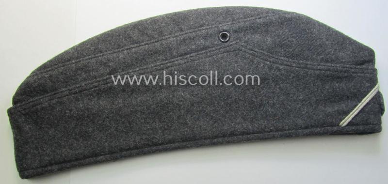 Darker-greyish-blue-coloured, so-called: German Red Cross (ie. 'Deutsches Rotes Kreuz' or: 'DRK' EM- (ie. NCO-) type side-cap (ie. 'Schiffchenmütze für Mannschaften u. Uffz. des deutschen Rotes Kreuzes')