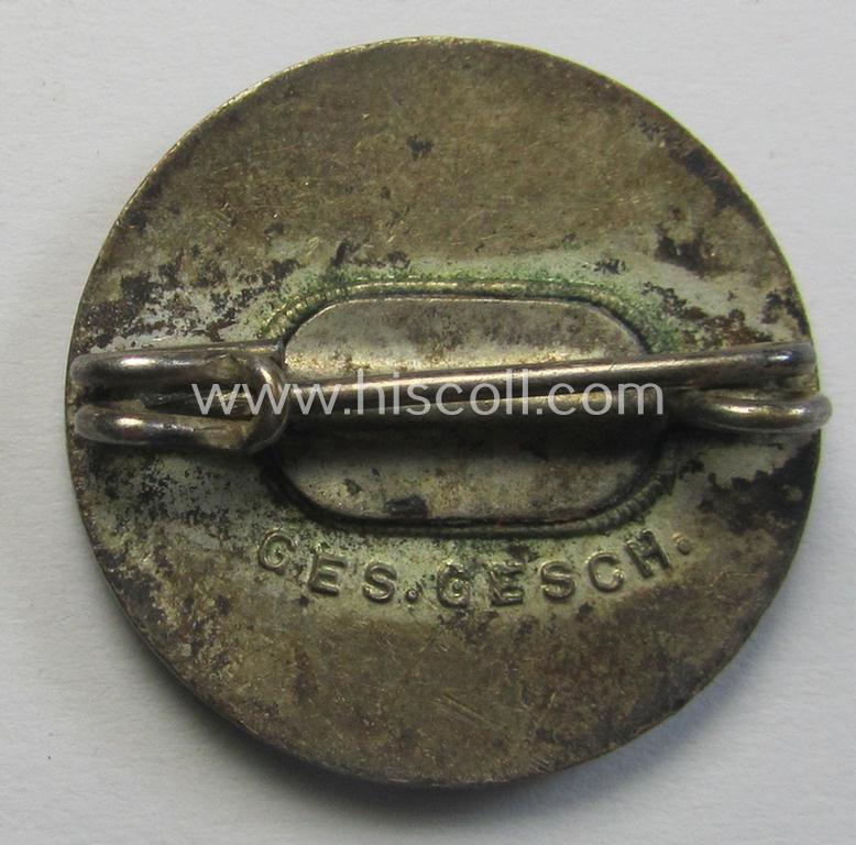 Attractive - darker-red-coloured and very nicely preserved! - 'variant'-pattern 'N.S.D.A.P.'-supporter-pin- ie. party-badge (or: 'Parteiabzeichen') being a regular-sized specimen that shows a 'Ges.Gesch.'-patent-pending-designation
