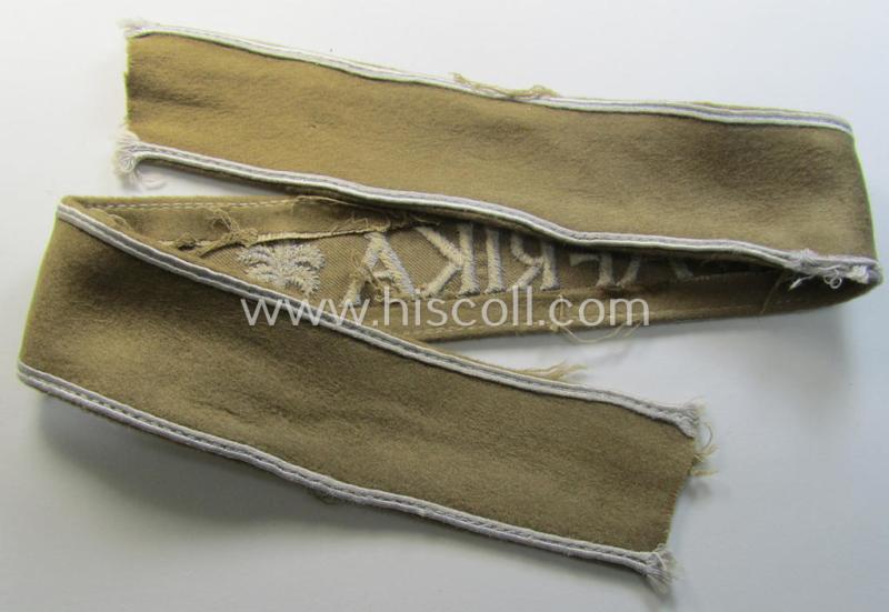 Attractive, WH (LW o. Heeres) cuff-title (ie. 'Ärmelstreifen') entitled: 'Afrika' (being an example that comes in a presumably issued- albeit simply never used- ie. 'virtually mint' condition)
