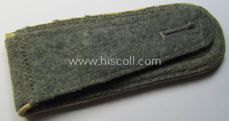 Single, WH (Heeres) NCO-type (ie. 'M40'- ie. 'M43'-pattern) shoulderstrap having the white-coloured branchcolour as was intended for - and clearly worn by! - a: 'Feldwebel der Infanterie-Truppen'