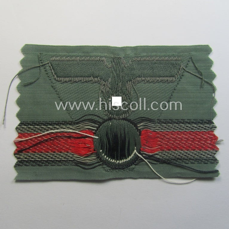 WH (Heeres) so-called: 'M43-pattern') cap-eagle/cocarde (ie. cap-trapezoid) as was specifically produced for usage on the so-called: 'M-43'-model field-caps (ie. 'Einheitsfeldmützen')