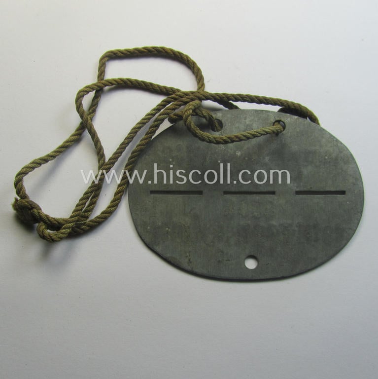 Zinc-based, WH (Heeres) 'Gebirgsjäger-Pioniere'-related ID-disc bearing the clearly stamped unit-designation that reads: 'Stamm. Geb.Pi. E.u.A. Btl. 82' and that comes as issued and/or worn