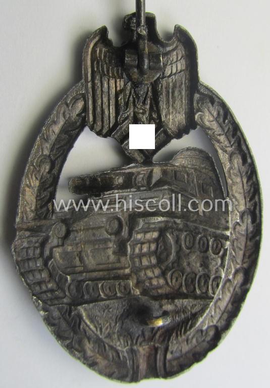 'Panzerkampfabzeichen in Silber' (or: silver-class panzer-assault badge or PAB) being a (typical) non-maker-marked- and/or hollow zinc- (ie. 'Feinzink'-) based example as was produced by the: 'Wilh. Deumer'-company