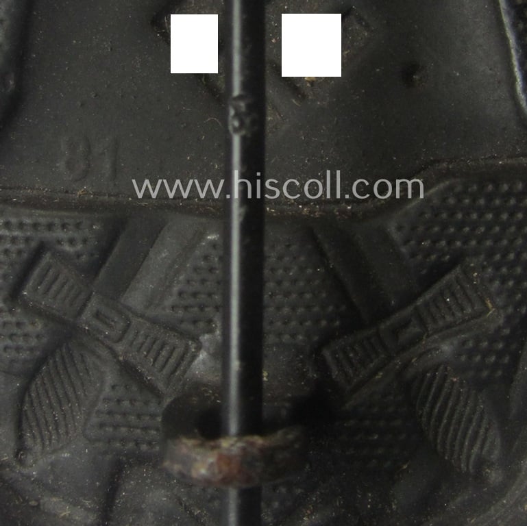 Neatly (double!) maker- (ie. '81'-) marked example of a black-class wound-badge (or: 'Verwundeten-Abzeichen in Schwarz') being an example that was produced by the maker (ie. 'Hersteller') named: 'Overhoff & Cie.'