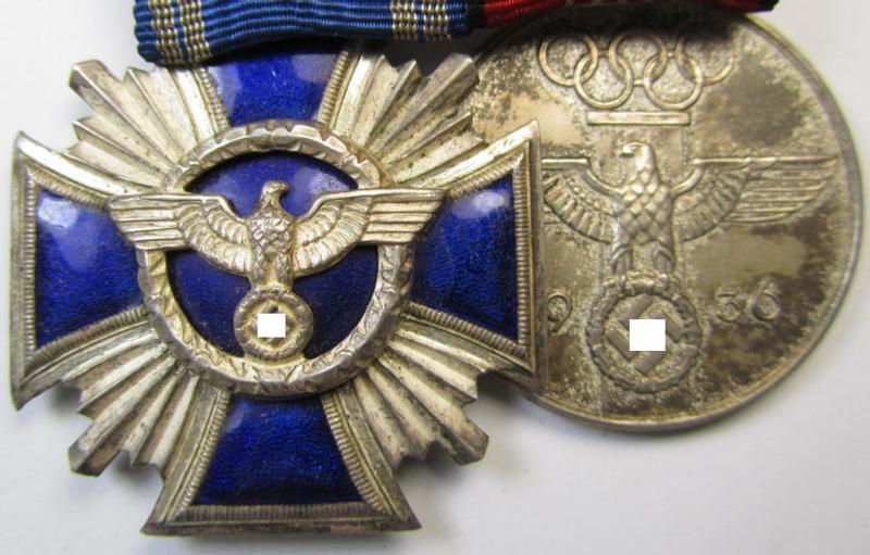 Superb, two-pieced medal-bar (ie. 'Ordenspange') showing resp. an: 'N.S.D.A.P. D.A. in Silber' (ie. '2. Stufe für 15 Jahre t. D.') and a: 'Deutsche Olympia-Erinnerungsmedaille 1936' that both come mounted as a (detachable!) 'Doppelspange'
