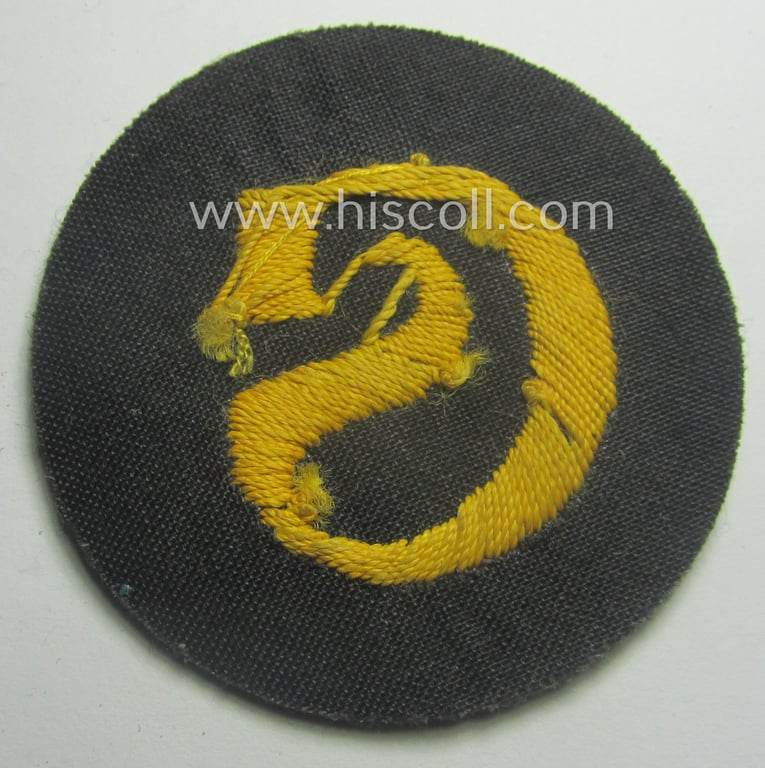 WH (Heeres) so-called: trade- and/or special-career arm-insignia (ie. 'Laufbahn- o. Tätigkeitsabzeichen') as intended for a: 'Schirrmeister' (being a neatly hand-embroidered variant as mounted onto a field-grey-coloured- and woolen-based background