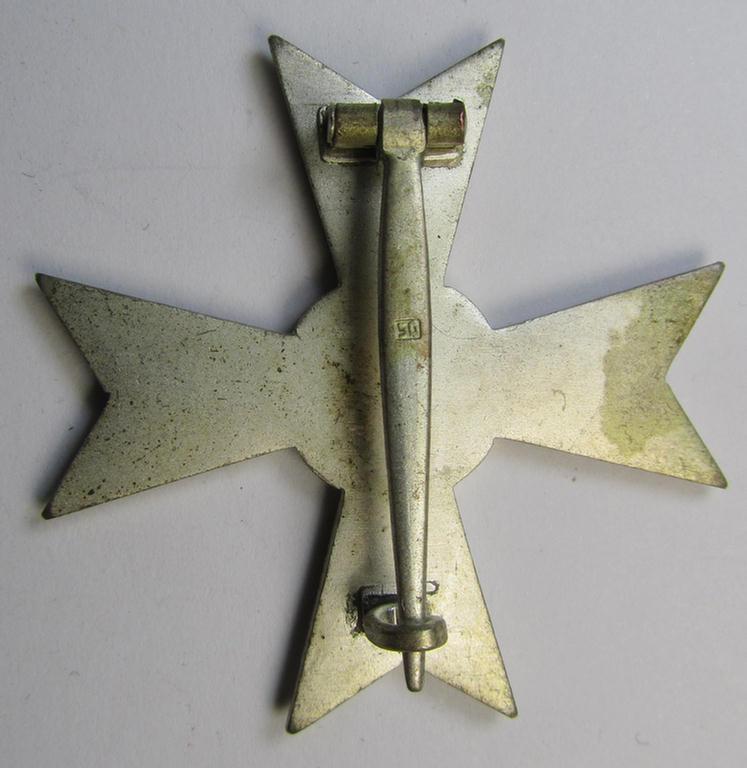 Luxuriously-styled, 'Kriegsverdienstkreuz 1. Klasse ohne Schwertern' being an attractive and maker- (ie. '50'-) marked specimen that is executed in typical, silverish-coloured metal (ie. 'Buntmetall') and that comes in a moderately used conditi...
