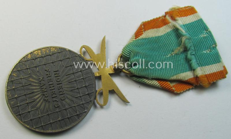 Attractive, WH-related so-called: 'Azad Hind - Goldene Tapferkeits-Medaille mit Schwerten' (being a typical non-maker-marked- and/or: 'Feinzink'-based example that comes mounted onto its period ribbon)