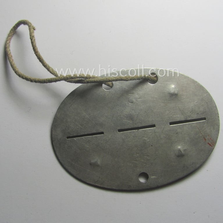 Aluminium-based, WH (Heeres) ie. 'leichte Artillerie'-related ID-disc bearing the clearly stamped unit-designation: '7.(L) Bttr. III.\A.R.260'