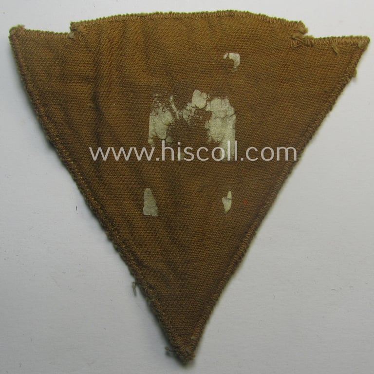 Attractive, so-called: N.S.K.K. (ie. 'National Socialistisches Kraftfahr Korps') arm-eagle (showing a combined arm-eagle and/or chevron) as executed in so-called: flatwire, 'BeVo'-weave pattern and comes mounted onto a beige-coloured background