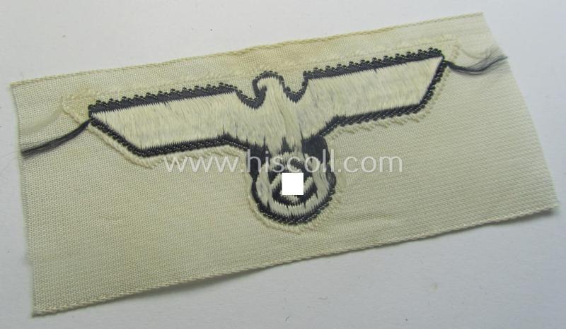 WH (KM) EM- (ie. NCO-) type side-cap-eagle (ie. 'Schiffchenadler für Mannschaften u. Uffz. der KM') as executed in the 'BeVo'-weave-pattern on a white-coloured background as was specifically intended for usage on the various white-coloured side-c...