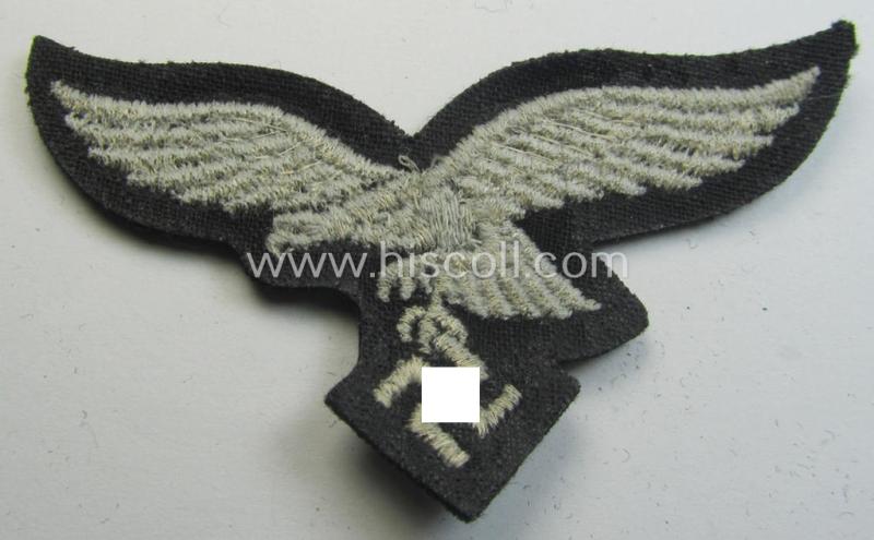 Attractive, WH (Luftwaffe) cap-eagle (being a 'standard-issue'-pattern example as executed onto a black-coloured and woolen-based  background and as such intended for usage on the black-coloured work- ie. 'HG'-related side-caps ie. 'Schiffchen'...