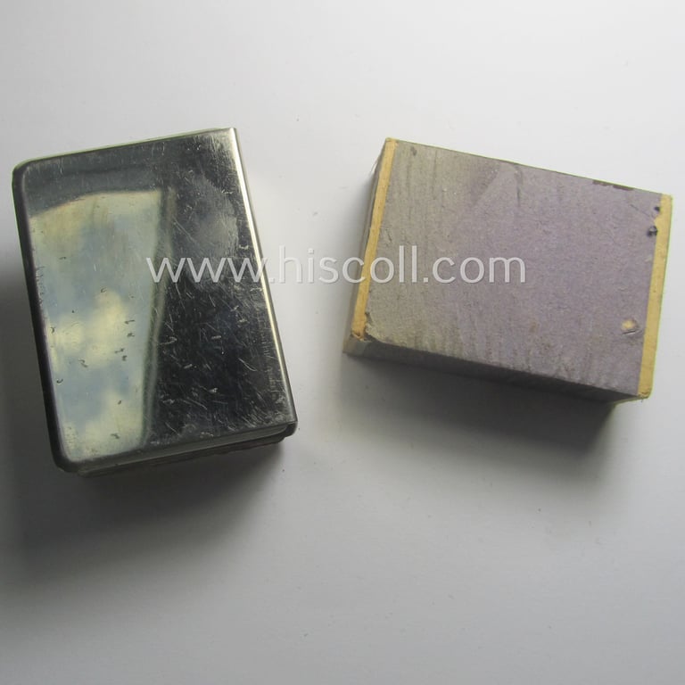 Interesting, WWII-period 'souvenir-item' (ie. match-box holder) showing on its front an illustration of a steel-helmet and upright-positioned sword coupled with the text: 'Westfront'