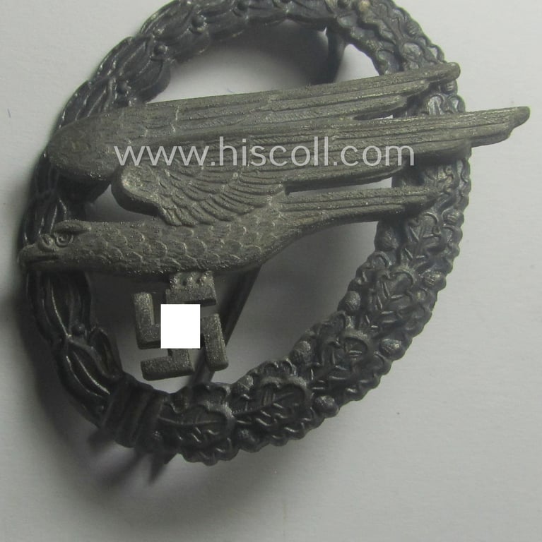 Superb, WH (Luftwaffe) 'Fallschirmschützen-Abzeichen' being a (typical and clearly!) maker- (ie. 'A'-) marked and 'Feinzink'-based example by the: 'Assmann & Söhne'-company that comes stored in its period etui
