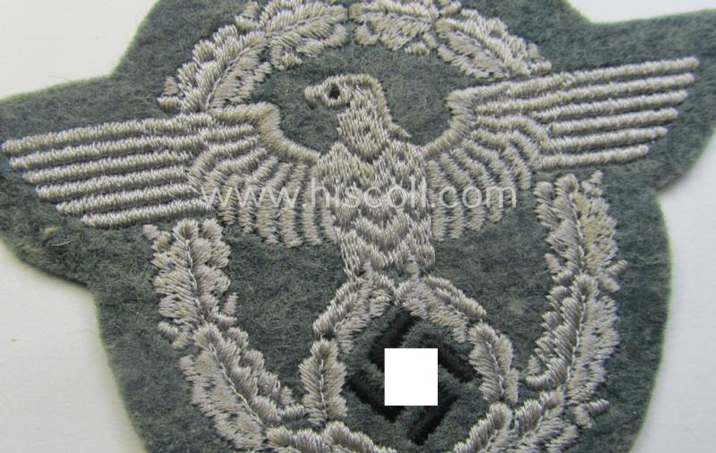 Police- (ie. 'Polizei'-) related armbadge (ie. arm-eagle) being a typical machine-embroidered example