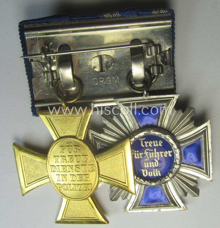 2-pieced, N.S.D.A.P.- and/or: 'Polizei'-related) medal-bar (ie. 'Spange') showing resp. a: 'N.S.D.A.P.-D.A. in Silber' (ie. '2. Stf. für 15 Jahre t.D.') and 'Pol.-Dienstauszeichnung 1. Stf.' that both come period-mounted as a: 'Doppelspang...