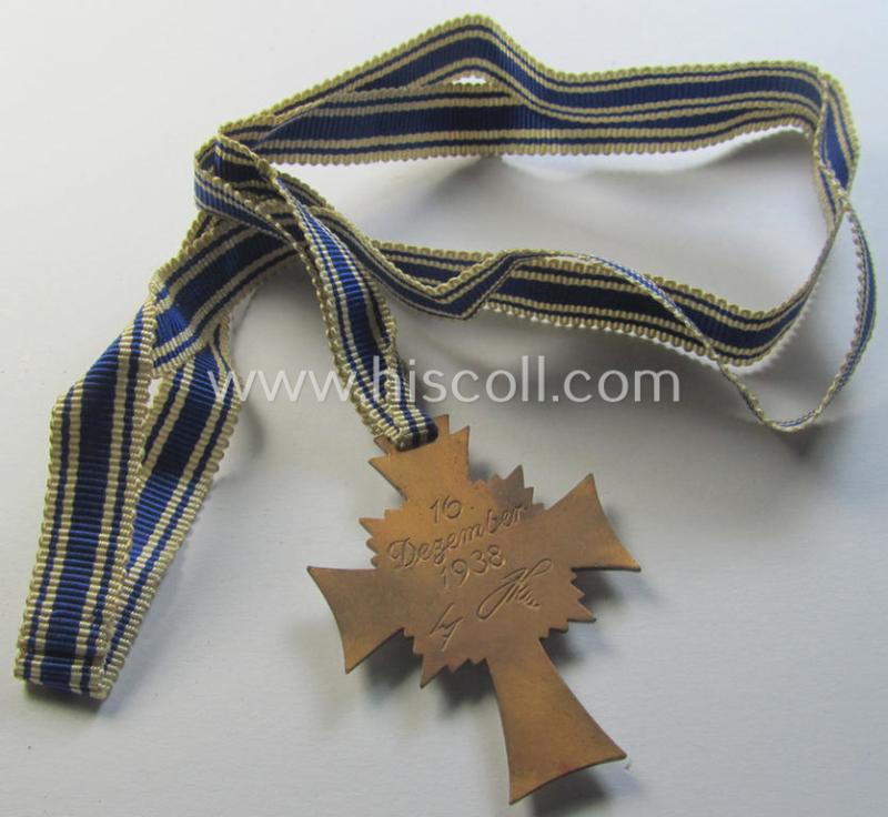 Neat, 'Ehrenkreuz der deutschen Mutter - dritte Stufe' being a non-maker-marked example that comes mounted onto its (large-sized!) ribbon and that comes in an overall very nice- (albeit minimally worn- ie. used-), condition