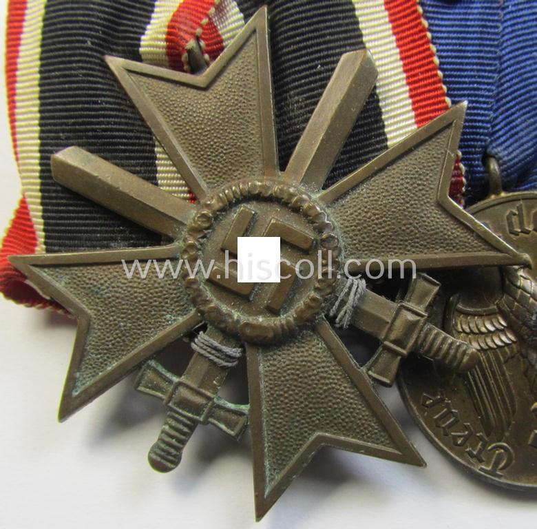Three-pieced medal-bar (ie. 'Ordenspange') respectively depicting a: 'KvK II. Klasse m. Schwertern' and two: WH (Heeres or KM) so-called: 'Dienstauszeichnungen für 4 u. 12 Jahre Treue Dienste'