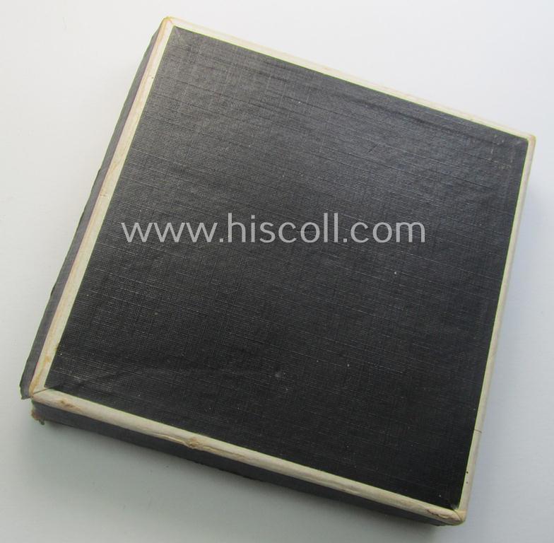 Regrettably damaged, earthenware (ie. 'Allach'-produced!): 'SS-Siegerplakette' as was issued during the: 'Sommer Sonnenwendwettkämpfen der SS' held in 1939 and that comes stored in its period, carton-based box as issued