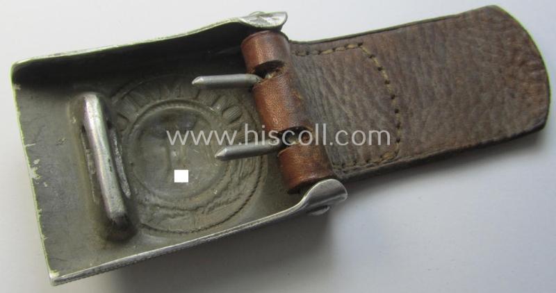 WH (Heeres) 'standard-pattern', field-grey-toned- and aluminium-based belt-buckle being a maker- (I deem 'Bernh. Haarmann'-) marked- and/or '1938'-dated example that comes mounted onto its leather-based tab