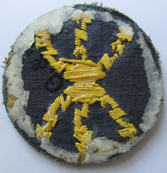 Neat, WH (Heeres) hand-embroidered, trade- ie. special career arm-patch, as intended for a: 'Funkmeister' (or radio-equipment NCO), executed on darker-green coloured wool, that is nicely maker-marked on the back - nice (ie. minimally used-) condition