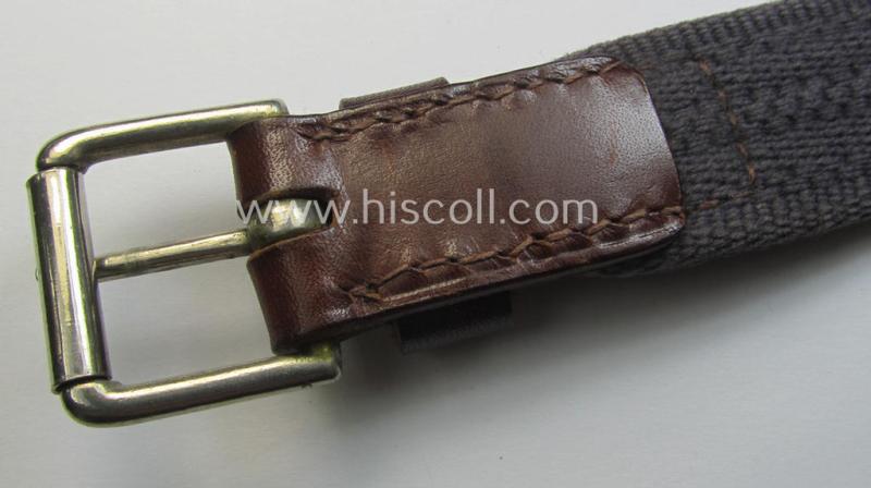 'Standard-issue'-pattern, WH trousers'-belt (or: 'Riemen für Hosen') as was executed in a combination of roughly woven blue-coloured linnen and/or brown-coloured leather