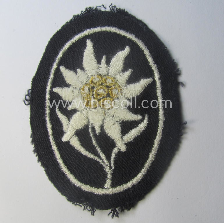 Waffen-SS-pattern, black-coloured sleeve-insignia (ie. 'Ärmelabzeichen') depicting an: 'Edelweiss'-flower as used by the various 'Gebirgsjäger'- (ie. mountain-troops-) related divisional-staff