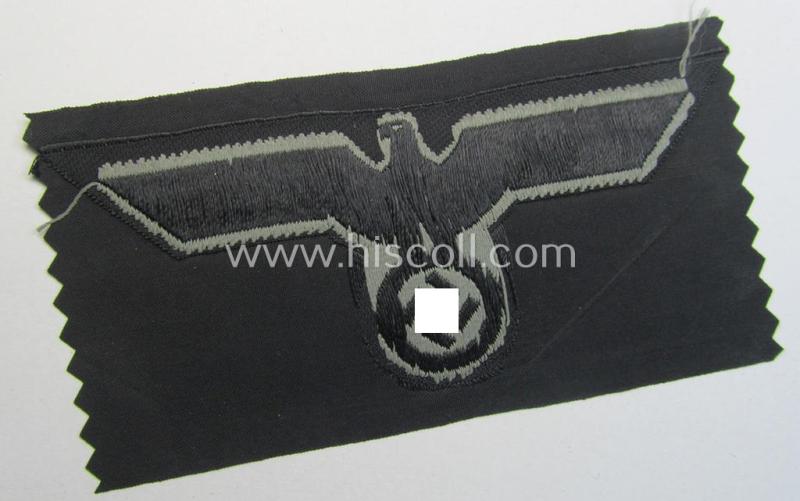 Later- (ie. mid-war-) period, WH (Heeres) 'Panzer'-type breast-eagle (ie. 'Brustadler für Panzertruppen') being a 'virtually mint- ie. unissued' example as executed in bluish-grey-coloured linnen on a black-coloured background