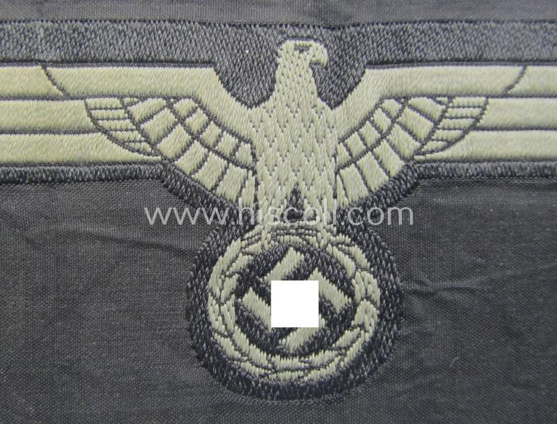 Later- (ie. mid-war-) period, WH (Heeres) 'Panzer'-type breast-eagle (ie. 'Brustadler für Panzertruppen') being a 'virtually mint- ie. unissued' example as executed in bluish-grey-coloured linnen on a black-coloured background