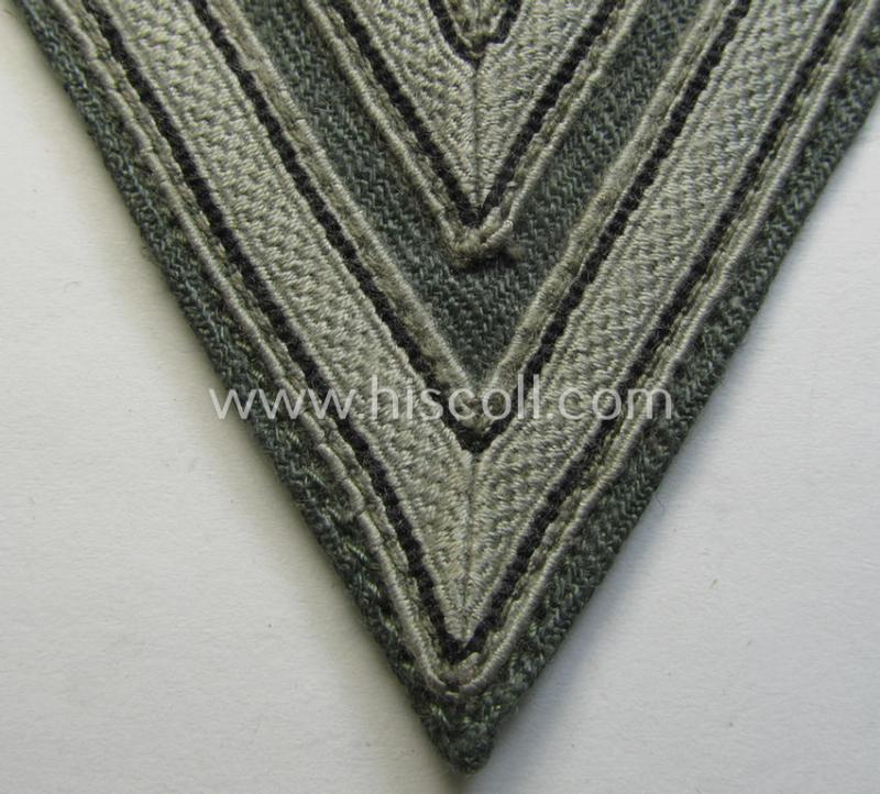 Neat, WH (Heeres ie. Waffen-SS) 'Armwinkel' (or: arm-chevron) as was executed on a greenish-coloured- and/or 'HBT'-like (ie. 'Drillich'-) based background as was specifically intended for usage by an: 'Obergefreiter' (ie. 'SS-Rottenführer')