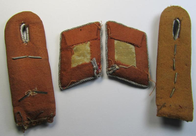 Moderately worn and fully matching, 4-pieced insignia-grouping comprising of a pair of WH (LW) officers'-type shoulderboards and dito collar-tabs as was intended for usage by a: 'Hauptmann u. Mitglied der Nachrichten-Truppen'