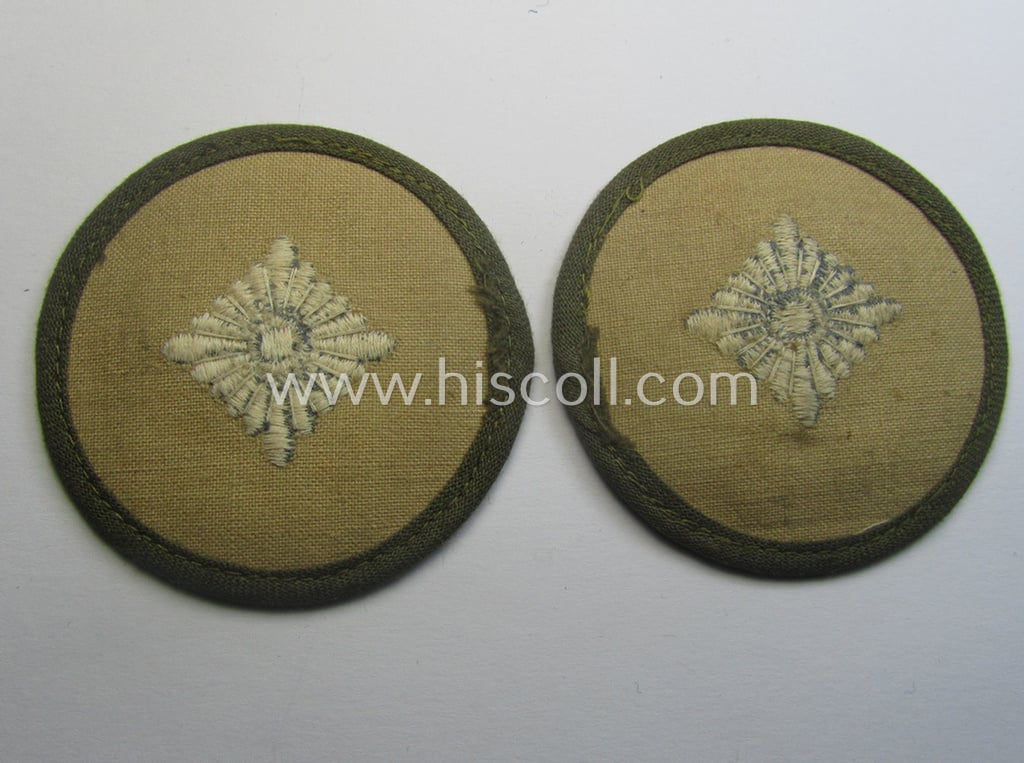 WH (Heeres) 'tropical'-pattern, machine-embroidered rank-insignia (ie. roundel) as executed in greyish-blue-coloured linnen as was intended for an: 'Oberschütze'