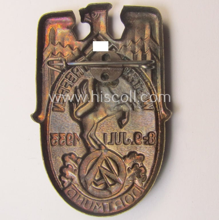 Commemorative, golden-bronze-coloured N.S.D.A.P.- (ie. 'SA- o. Sturmabteilungen'-) related 'tinnie' being a non-maker-marked example showing a detailed eagle-device, SA-logo- and text: 'Westfalentreffen - Dortmund - 8.9. Juli 1933'