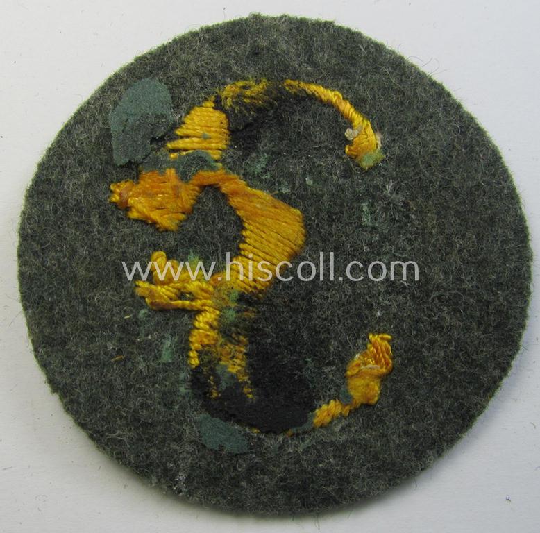 WH (Heeres) so-called: trade- and/or special-career arm-insignia (ie. 'Laufbahn- o. Tätigkeitsabzeichen') as was specifically intended for an army: 'Feuerwerker' (being a neatly hand-embroidered variant on field-grey-coloured wool)