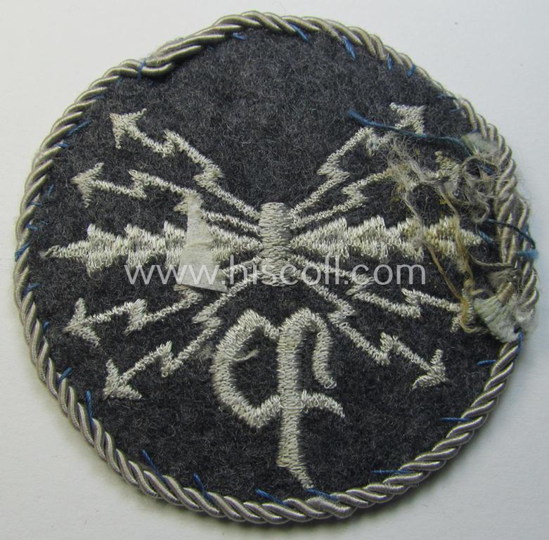 Attractive - albeit moderately used! - example of a WH (Luftwaffe) machine-embroidered, trade- ie. special-career-patch (ie. 'Tätigkeitsabzeichen') having a silver-white-toned 'Kordel' attached as was intended for: 'LW-Peilfunker'-staffmembers
