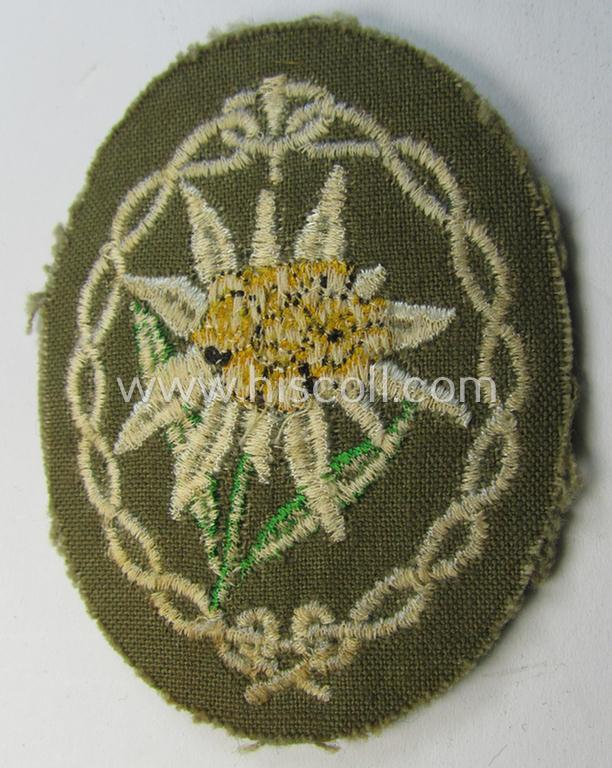Attractive - and 'virtually mint'! - WH (Heeres) EM- (ie. NCO-) type 'Edelweiss'-armpatch being a machine-embroidered example as was executed on darker-green wool as was intended for usage by the: 'Gebirgsjäger-Truppen' throughout the war