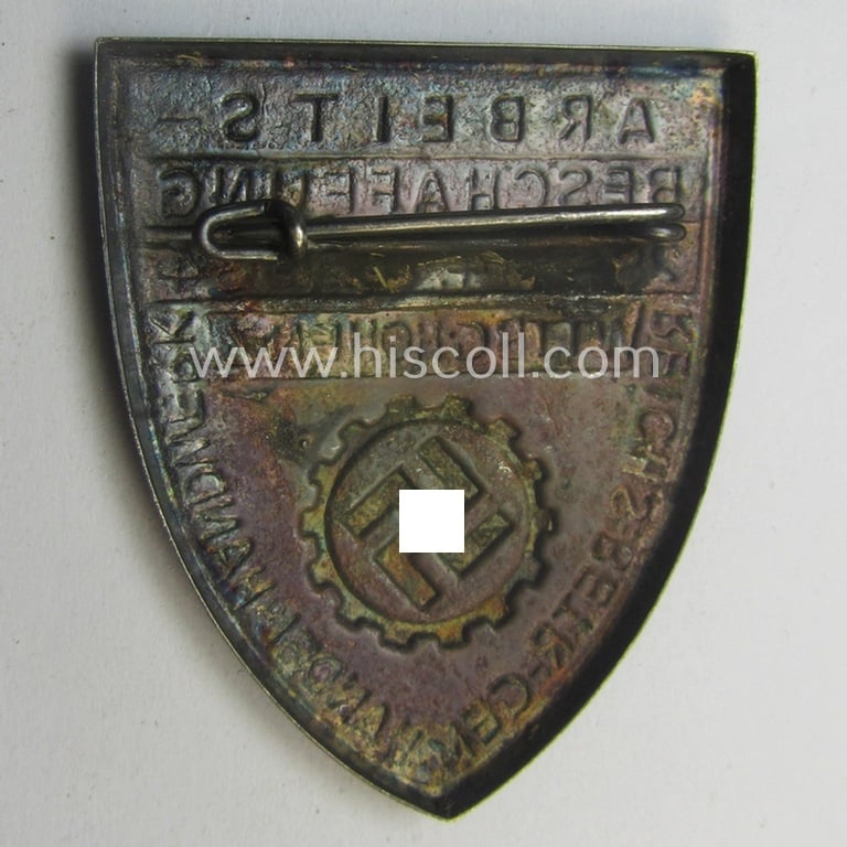 Silver-toned, DAF- (ie. 'Deutsches Arbeitsfront'-) related day-badge depicting a so-called: 'DAF-Zahnrad' and text: 'Arbeitsbeschaffung - 28.9.-14.10.1934 - Wttbg. Hohenz.' and sub-titled: 'Reichs-Betr. Gem. - Handel u. Handwerk'