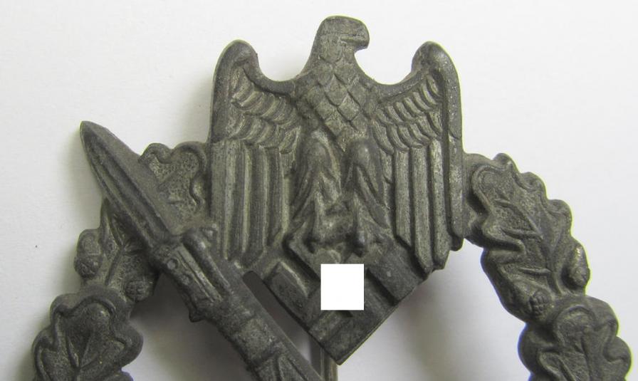 'Infanterie Sturmabzeichen in Silber' being a scarcely seen, non-maker-marked- and/or zinc- (ie. 'Feinzink'-) based specimen as was presumably procuded by the desirable: 'Ernst L. Müller'-company