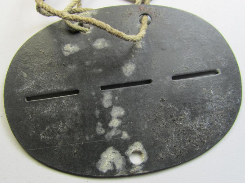 Zinc-based, WH (Heeres) 'Infanterie'- (ie. infantry-) related ID-disc, bearing the clearly stamped unit-designation that simply reads: 'Stabskp. Inf.Ers.Batl. 451' and that comes mounted on its period cord
