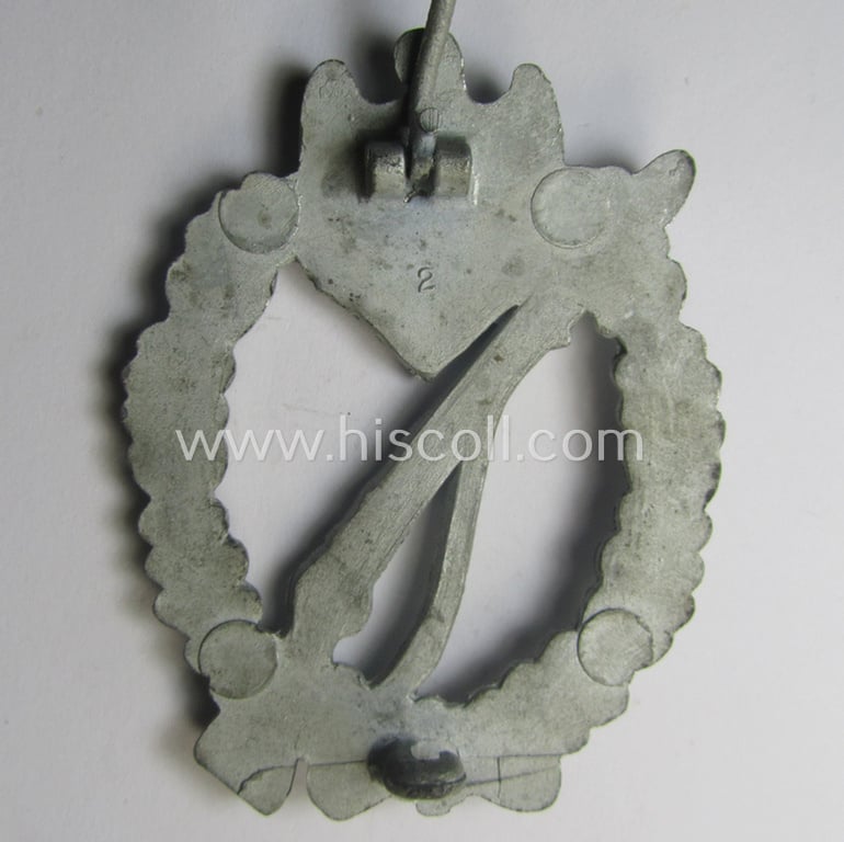 WH (Heeres- ie. Waffen-SS) 'Infanterie-Sturmabzeichen in Silber' (or: silver-class infantry assault-badge ie. IAB) being a maker- (ie. '2'- ie. 'Assmann') marked so-called: 'molded-pattern'-example as executed in zinc-based metal